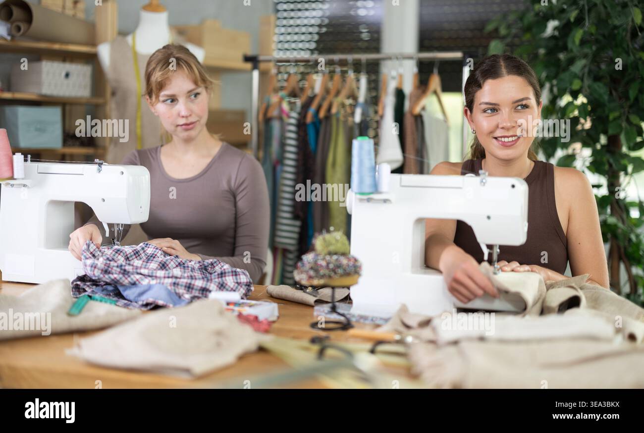 Two female tailors working in the workshop Stock Photo