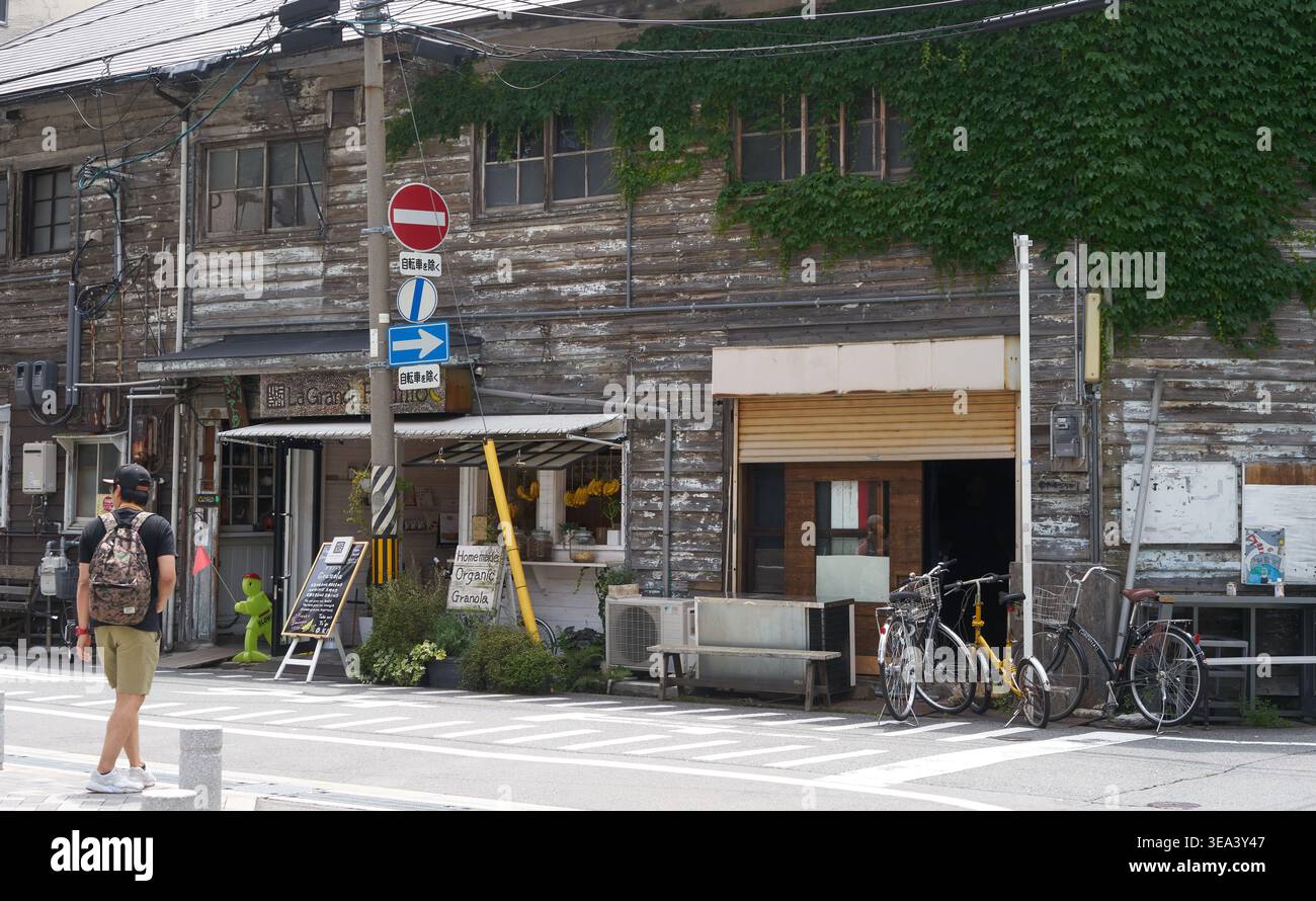 A nostalgic street scene in Nakazakicho, Osaka features a