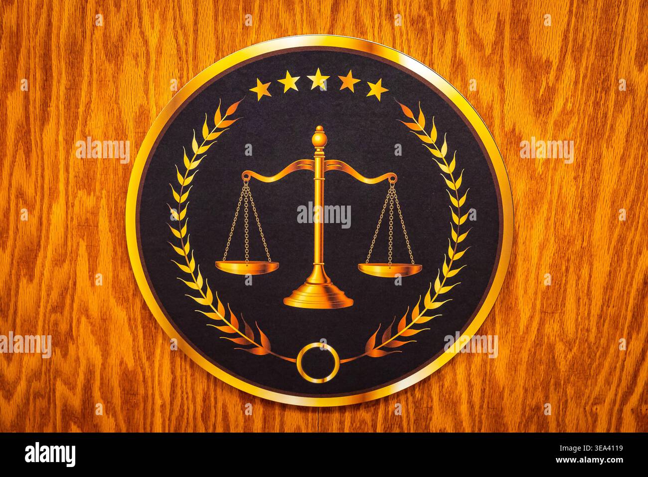 Scales of justice with laurel wreath and five gold stars on black ...
