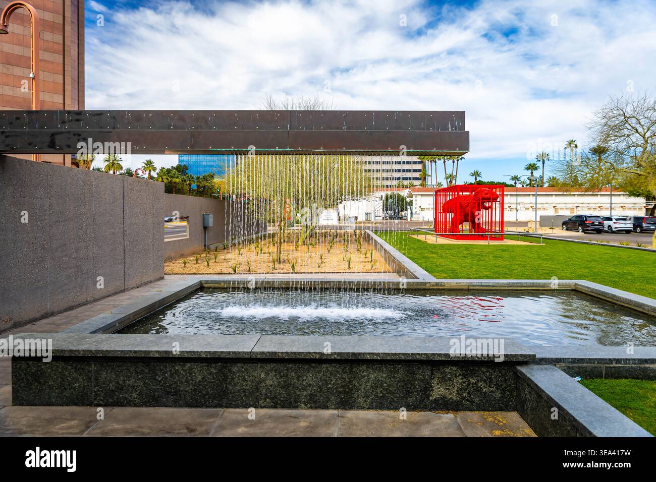 Phoenix, AZ, USA - February 05, 2026: Fountain and contemporary art installations decorate the entrance plaza of Phoenix Art Museum in Phoenix Arizona Stock Photo