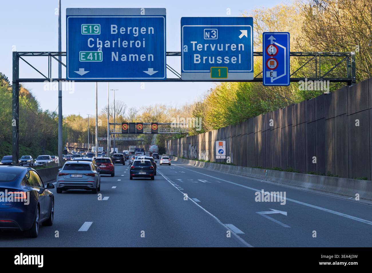 Tervuren, Belgium, April 8, 2026. Highway signage for the N3 route and E19/E411 routes with overhead speed limit displays. Stock Photo
