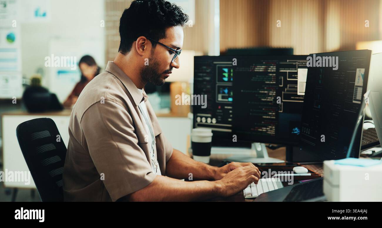 Typing, programmer and computer with business man in office for web developer, it expert and research. Software engineer, coding update and database Stock Photo