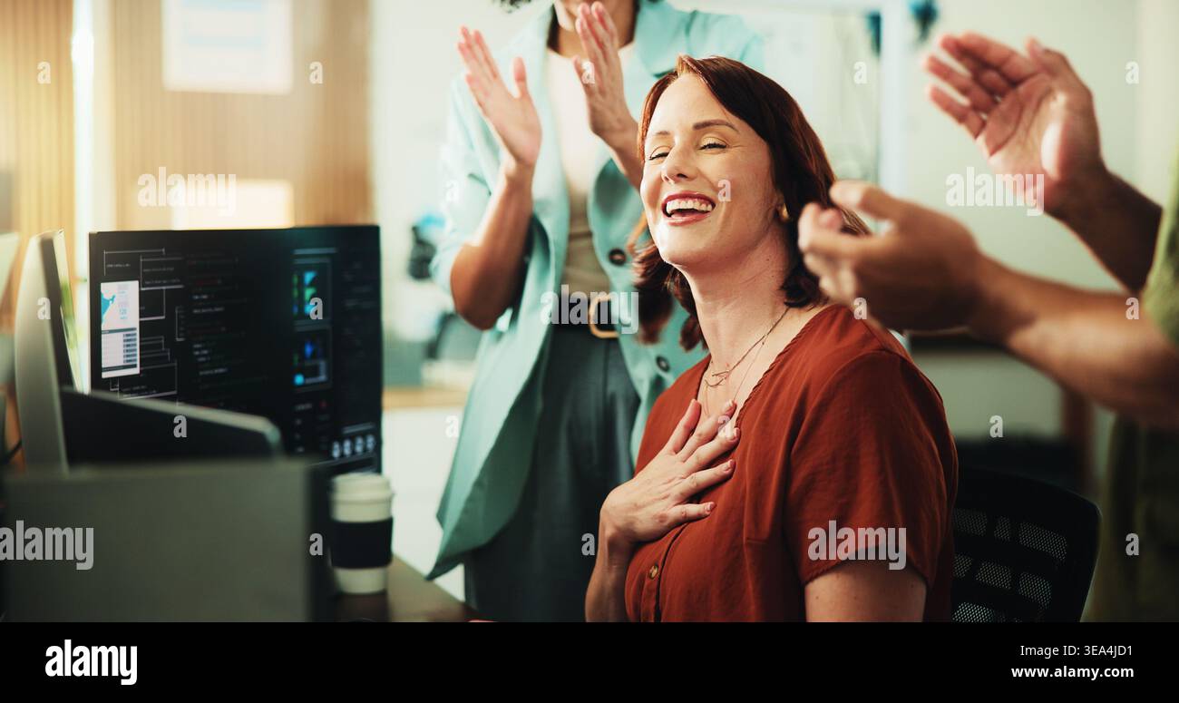 Computer, programmer and applause with business woman in office for app developer, support and database. It engineer, software launch success and Stock Photo
