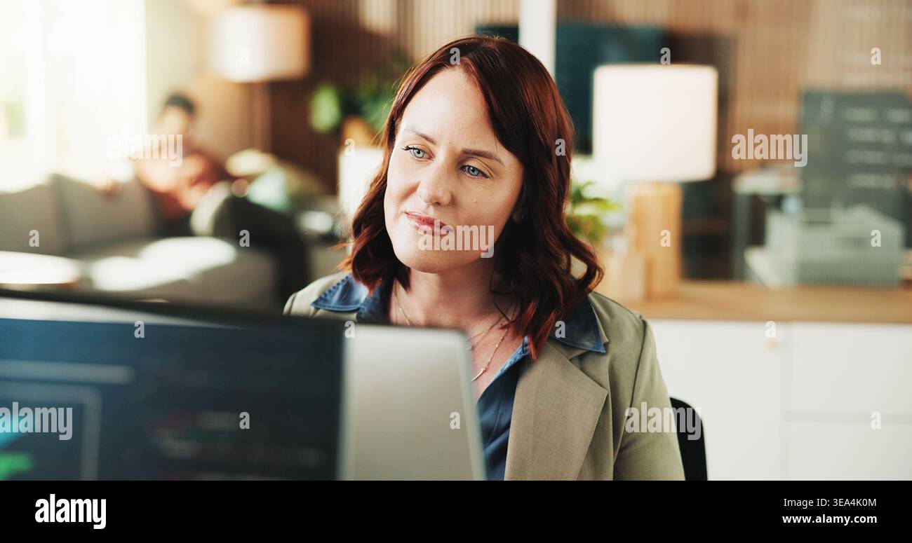 Computer, reading and programmer with business woman in office for web developer, code or database. Software engineer, firewall update and coding Stock Photo