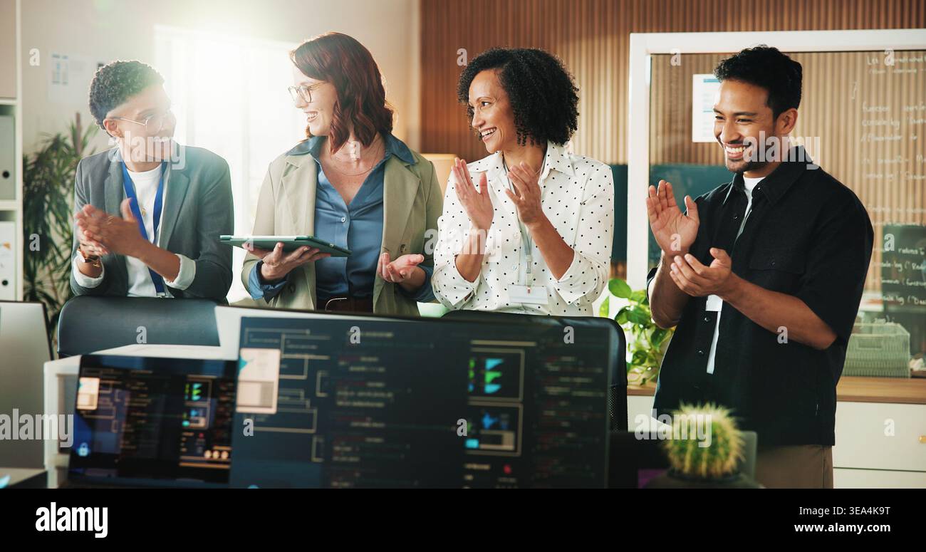 Applause, programmer and tablet with business people in office for app developer, support and database. It engineer, software launch success and Stock Photo