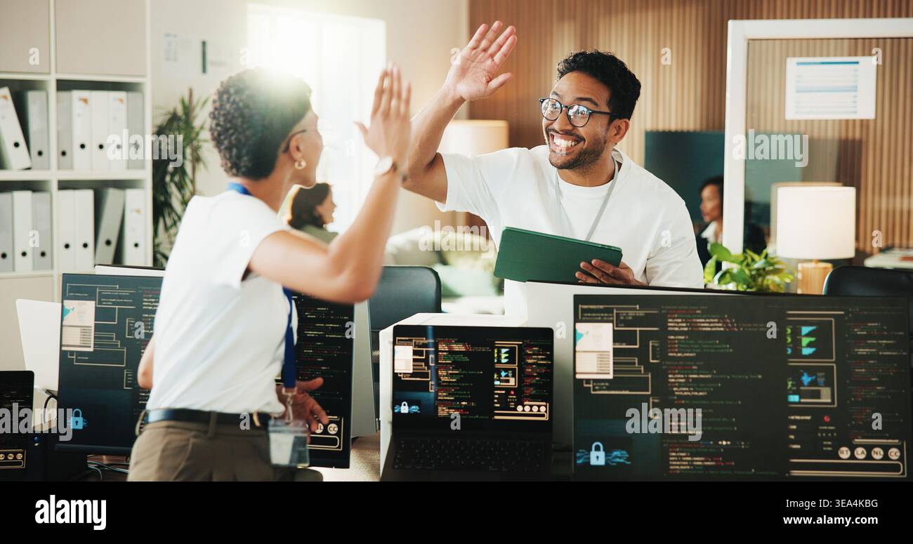 High five, programmer and tablet with business people in office for app developer, support and database. It engineer, software launch success and Stock Photo