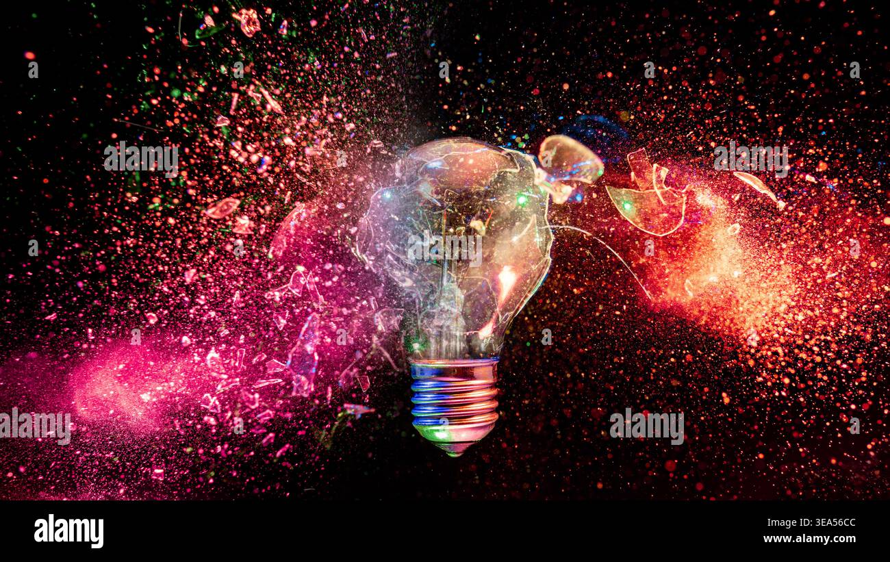 Real Light bulb exploding black background Stock Photo