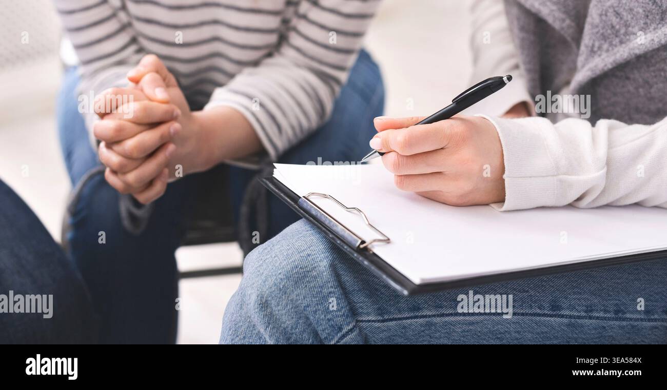Group Discussion Takes Place During a Session With Participants Engaged in Dialogue and Note-Taking Stock Photo