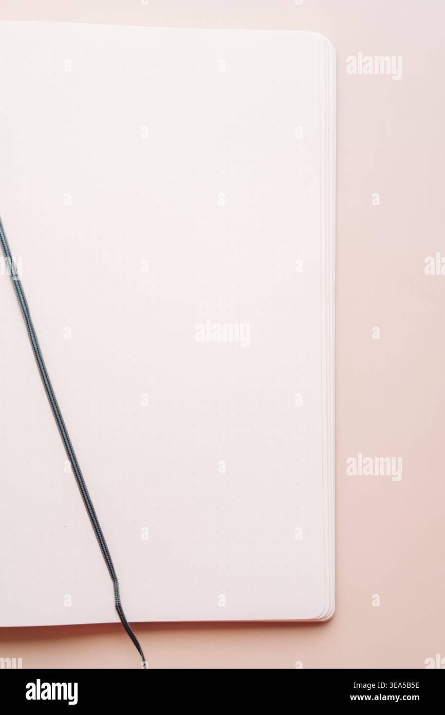 Blank notebook with ribbon bookmark on beige background Stock Photo