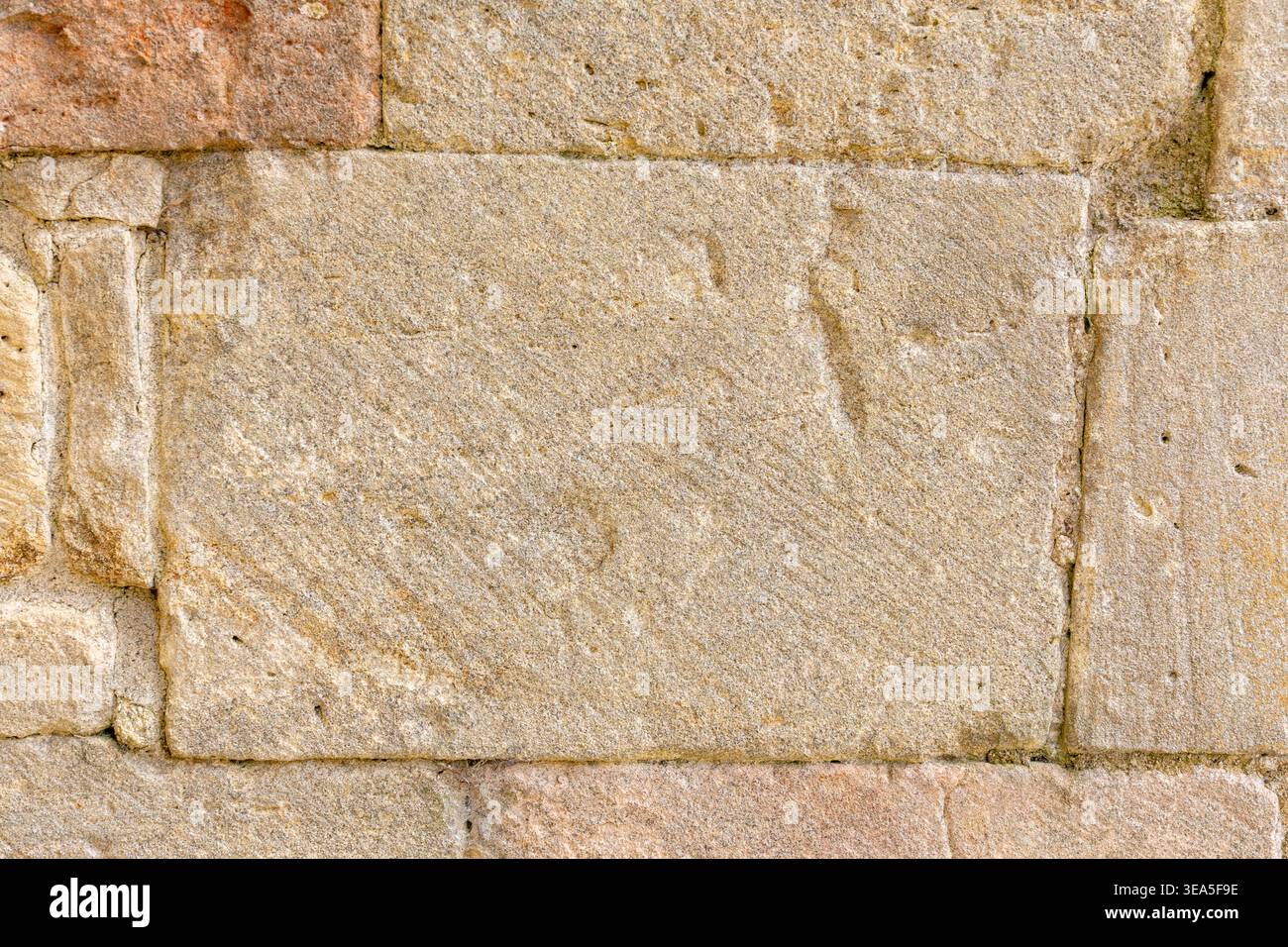 Light beige stone wall texture with rectangular masonry blocks for background Stock Photo