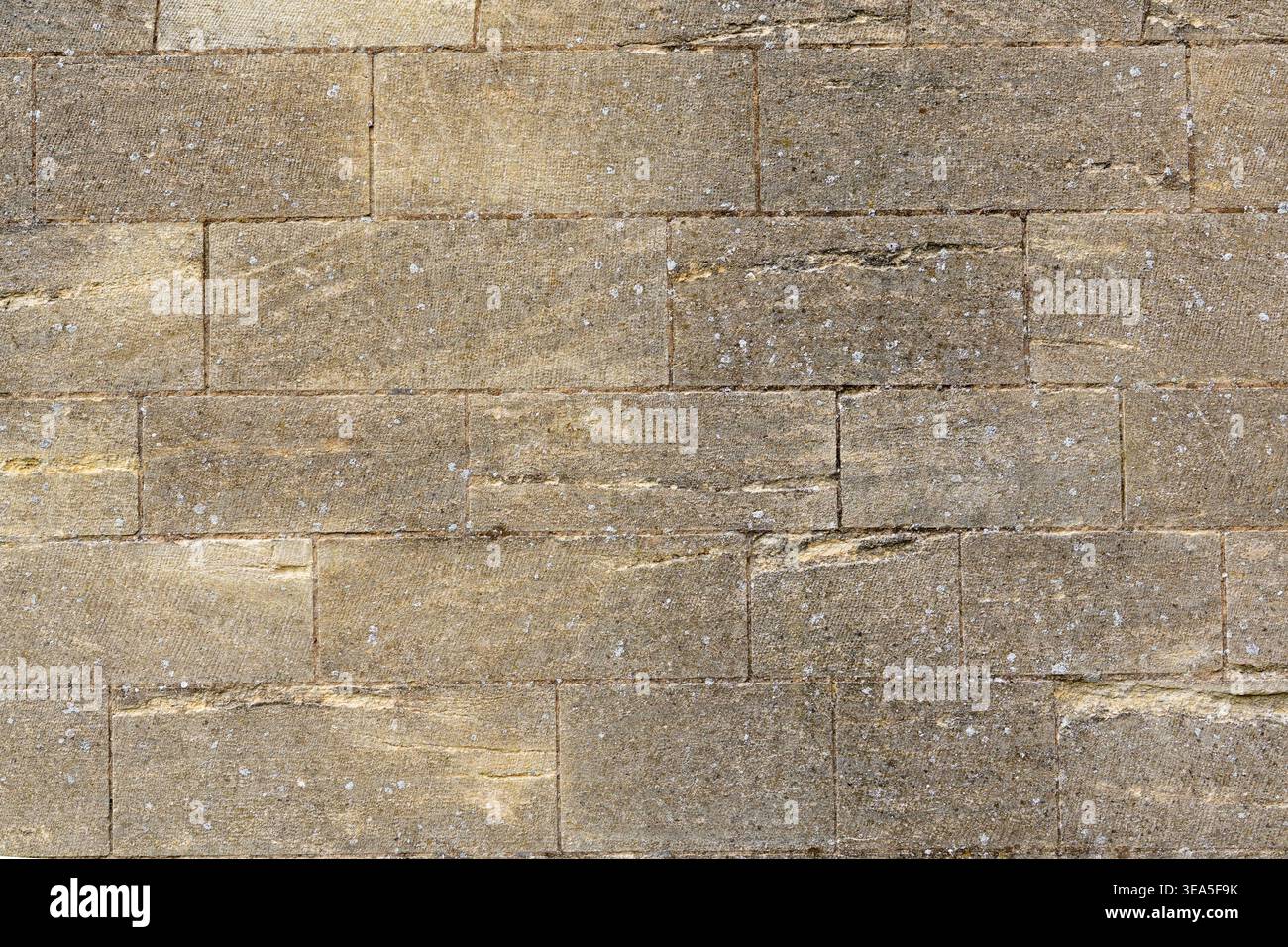 Light brown stone wall texture with rectangular masonry blocks for background Stock Photo