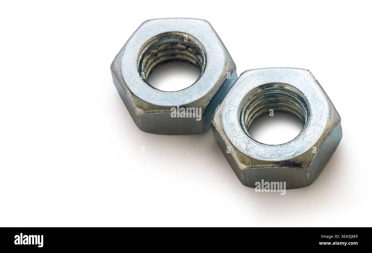 Construction nuts close-up on a white isolated background Stock Photo