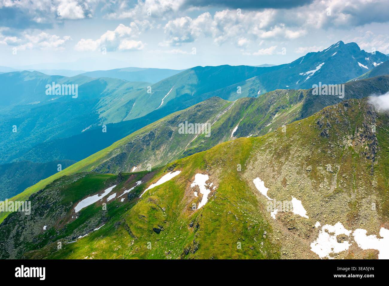 romania mountain scenery in summer. gorgeous mountainous landscape of carpathians. background with rocky cliffs and grassy hillsides under a cloudy sk Stock Photo