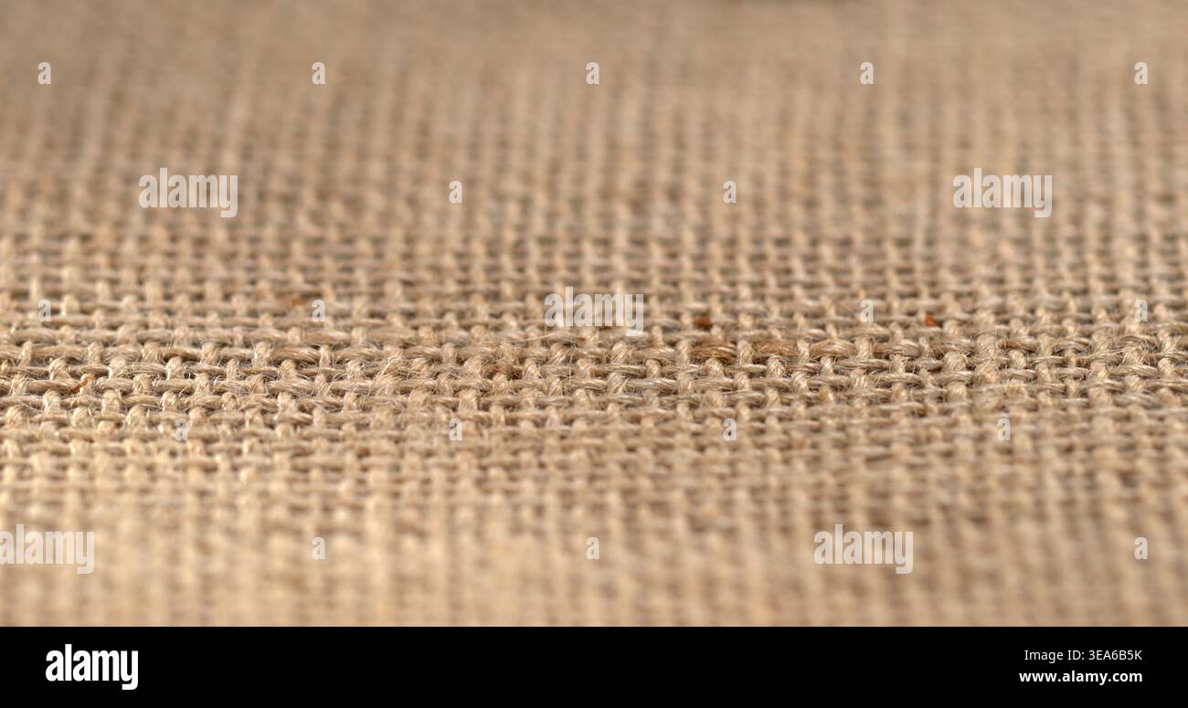 Woven fabric on a flat surface showing texture and natural fibers in a workshop setting during the daytime Stock Photo