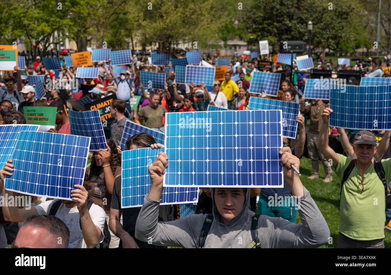 Solar Rally FILE - Activists display prints replicating solar panels during a rally ...