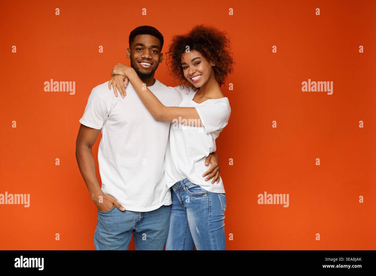 Cheerful african american man and woman embracing Stock Photo