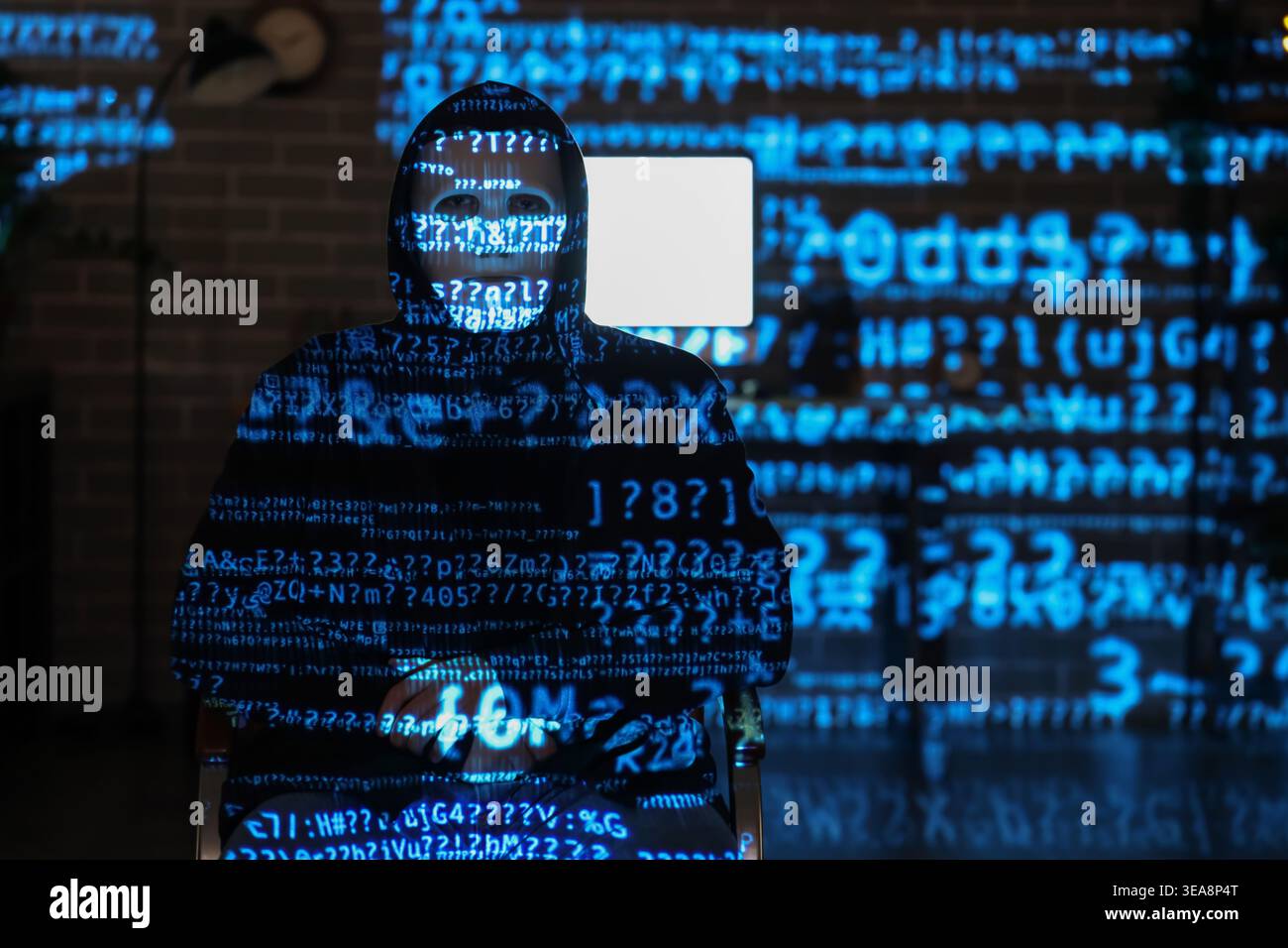 Hacker and projection of programming code in dark room Stock Photo