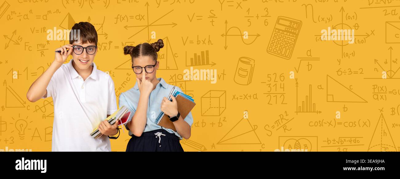 Students Working Together on Math Projects in a Classroom Setting During the School Year Stock Photo