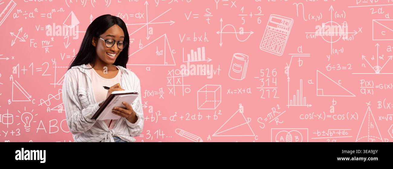 Student Writing Notes While Learning Math Concepts in a Classroom Setting With a Pink Background Stock Photo