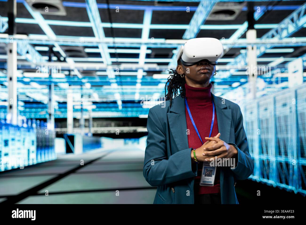 Data center admin using VR goggles to implement power management solutions reducing energy consumption. Server farm IT specialist refining algorithms for faster processing using virtual reality tech Stock Photo