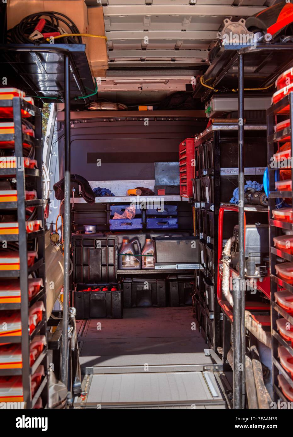 The interior of a professional service vehicle features metal shelving ...