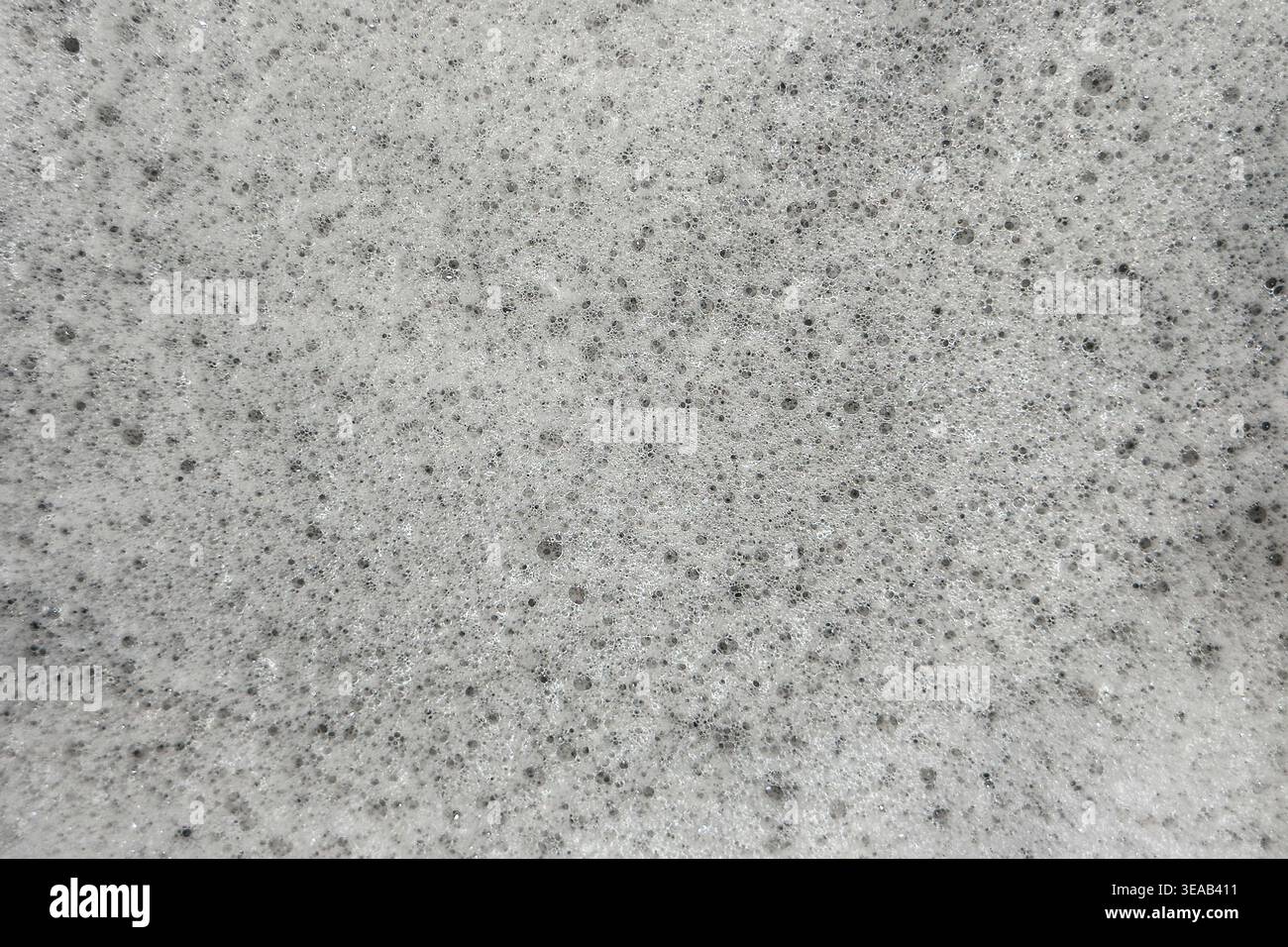 Soap suds foam and bubbles create an organic, textured background element. Stock Photo