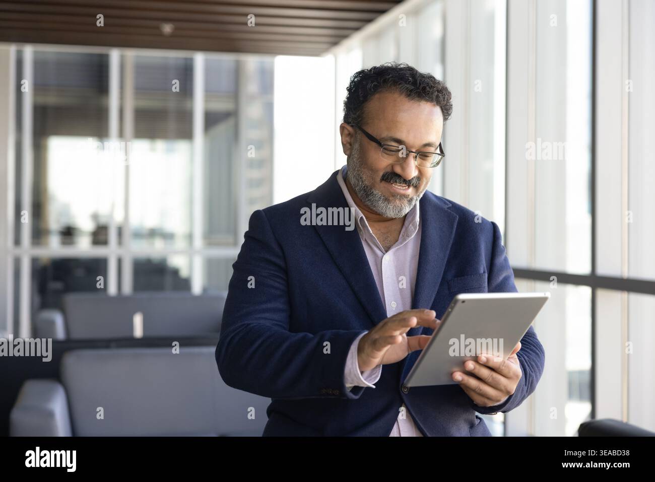 Business professional using tablet for digital workflow Stock Photo