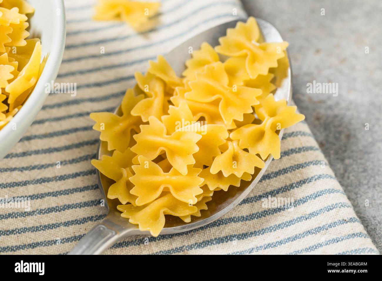 Organic Mini Farfalle Bow Tie Pasta in a Bowl Stock Photo