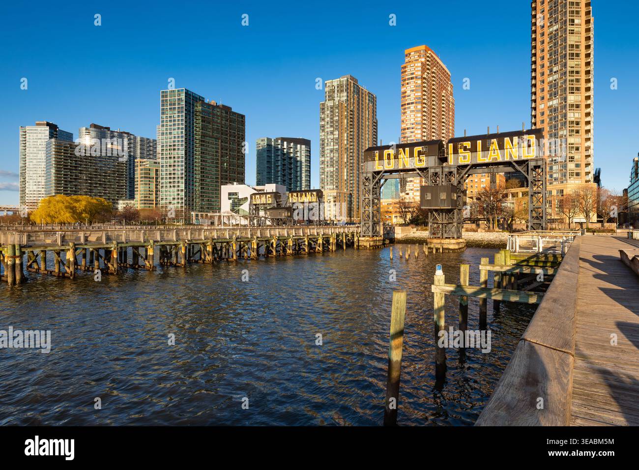 Long Island City waterfront at Gantry Plaza State Park, Queens, New York City, with iconic gantries, piers and modern residential towers Stock Photo