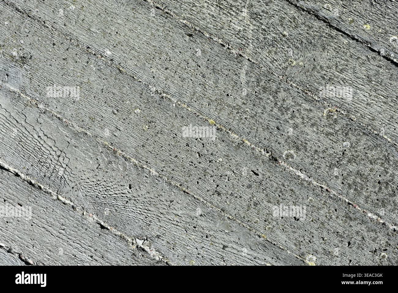 Diagonal texture of weathered grey concrete with wood grain imprints ...