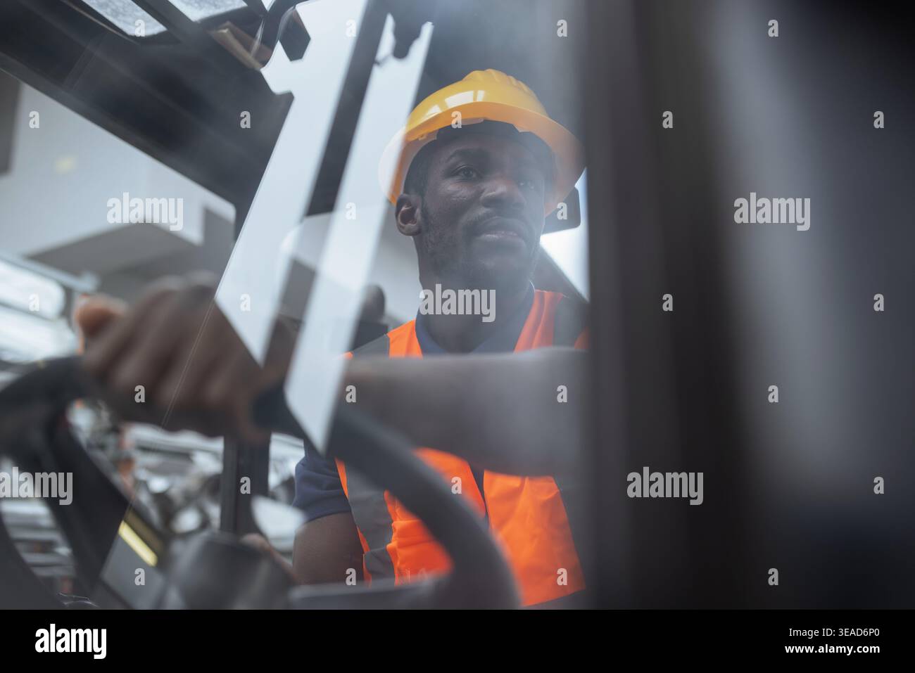 Worker Operator Portrait of a worker operator in a metal warehouse wearing personal ...