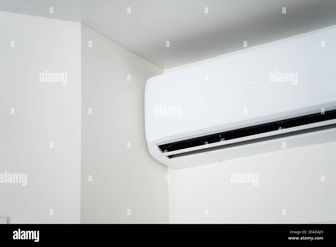 White wall mounted air conditioner unit cooling room, modern hvac ...