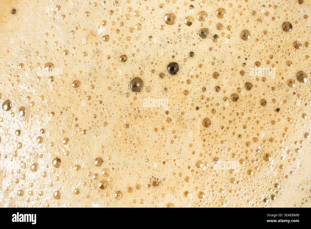 Brown and gold coffee bubbles texture for culinary background. Stock Photo