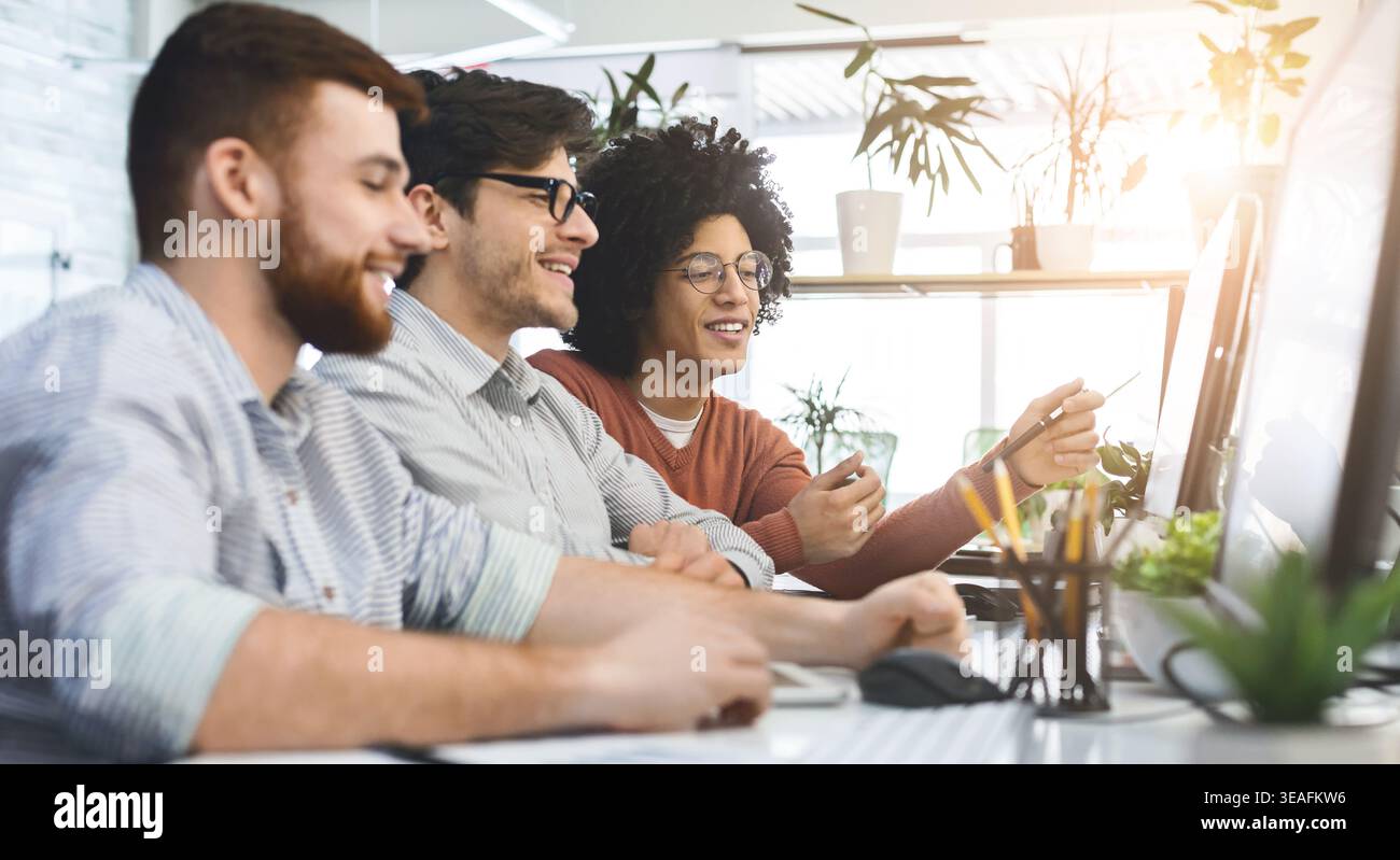 Group of young programmers developing data code Stock Photo