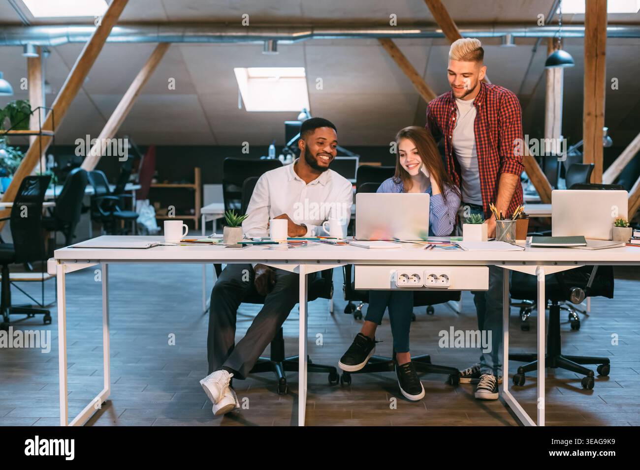 Deadline concept. Creative team working late at night Stock Photo