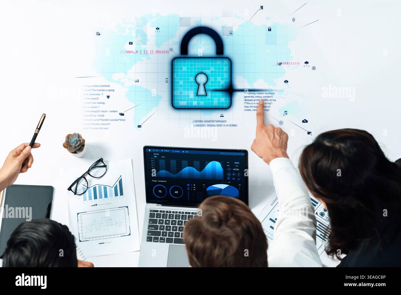 Professionals collaborate to enhance cybersecurity measures, analyzing data with graphs and charts on a laptop, discussing effective strategies agains Stock Photo