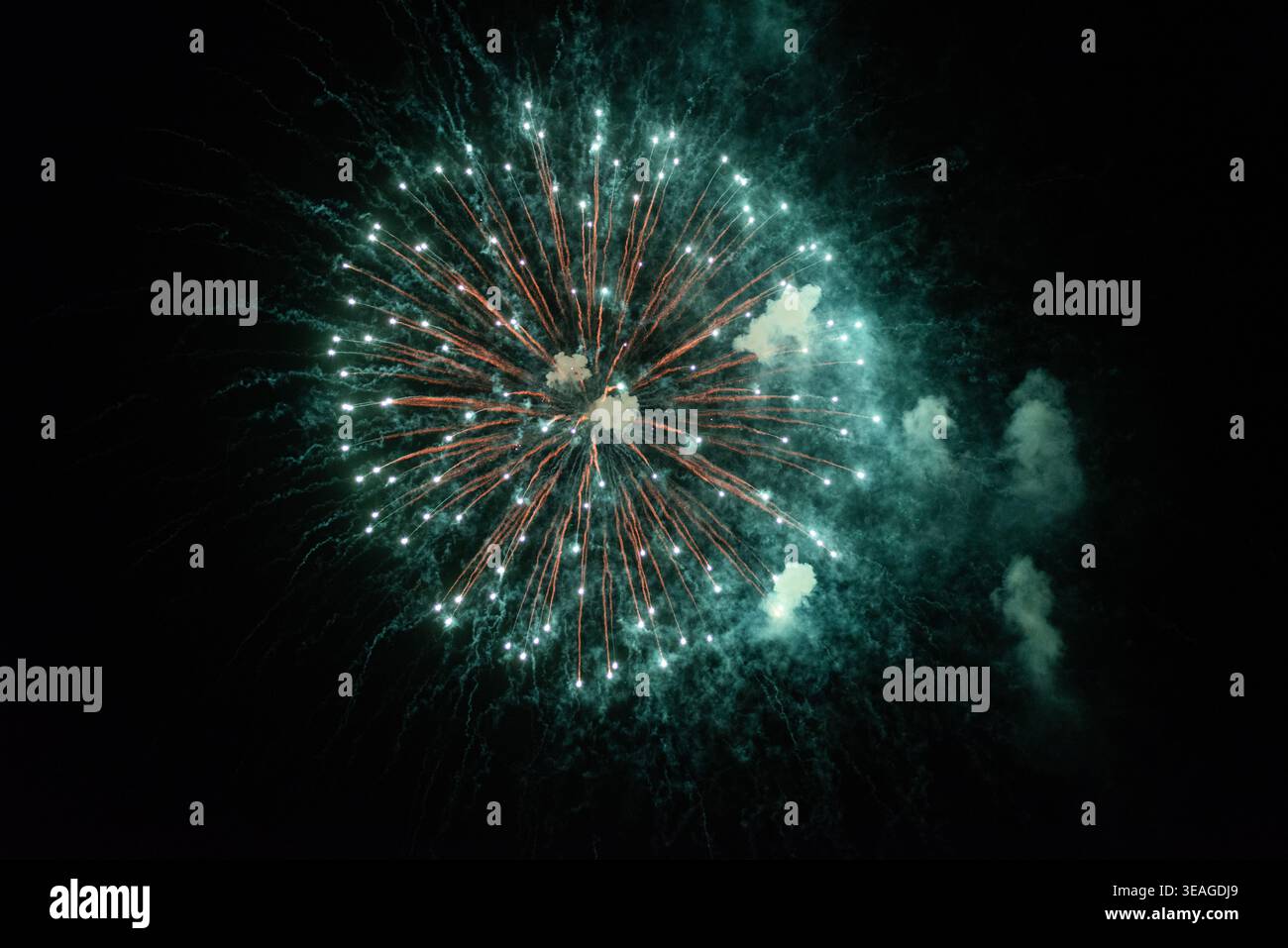 Fireworks explode in the sky. Stock Photo