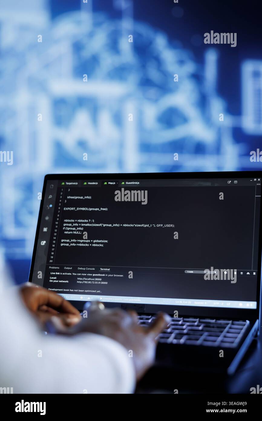 Licensed developer updates neural networks made up of interconnected nodes, writing intricate binary code scripts on laptop. Specialist uses programming to upgrade AI simulation model, close up Stock Photo