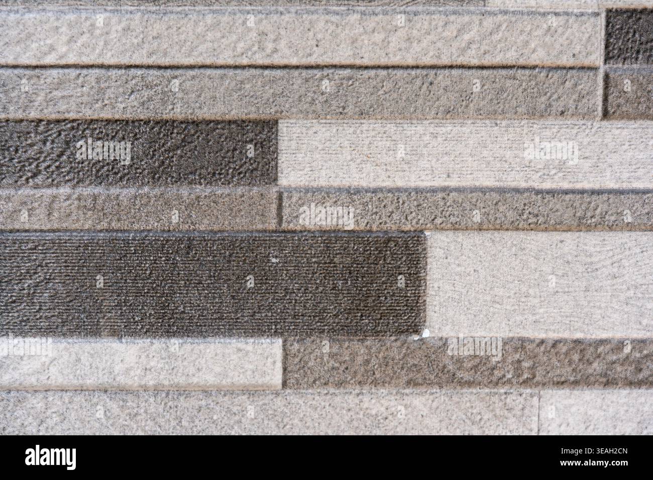 Modern Gray and White Horizontal Rectangular Tile Wall Texture Background with Varying Shades Stock Photo