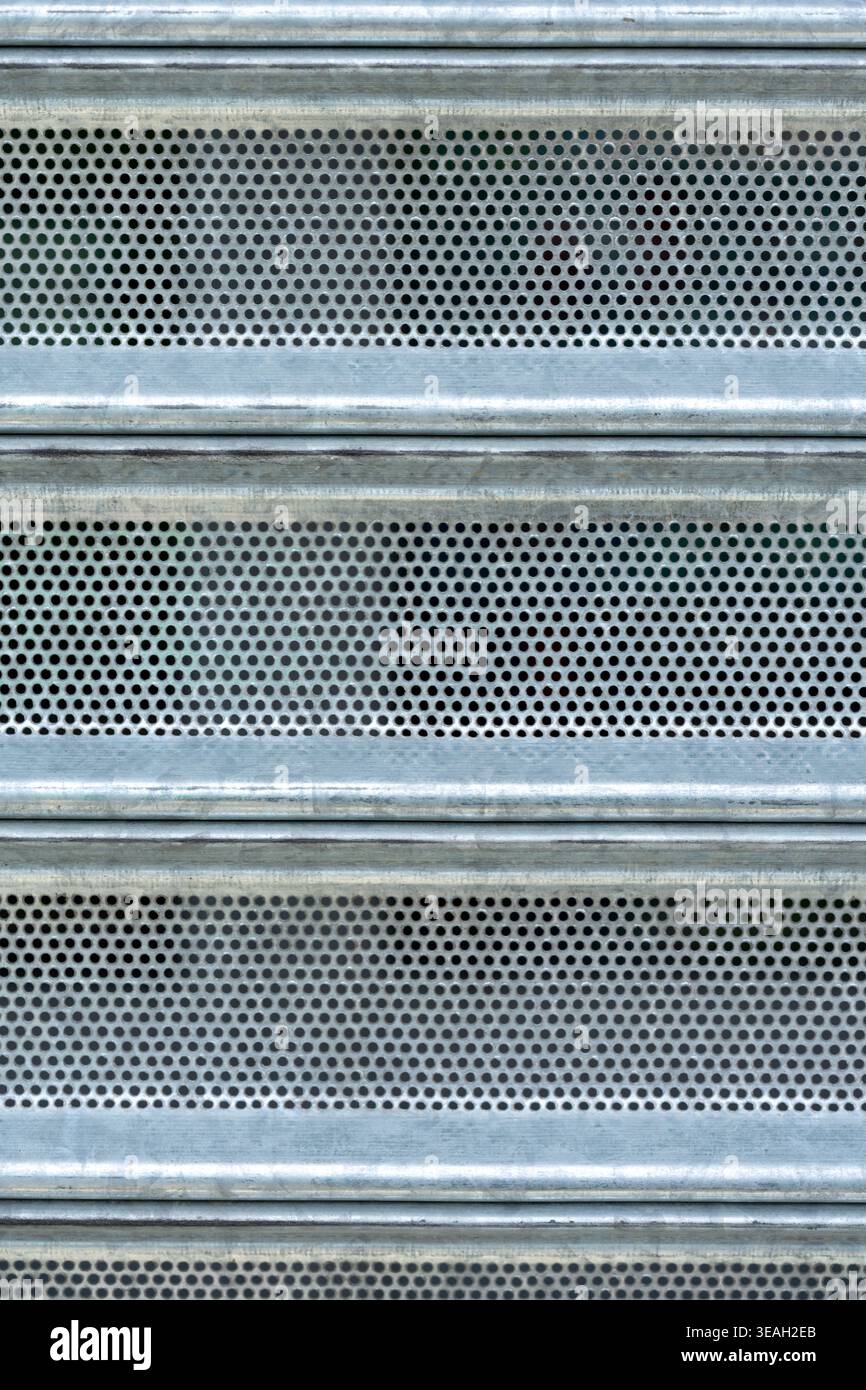 Security Screen Texture: Full Frame View of Industrial Metal Mesh and Solid Panels Stock Photo