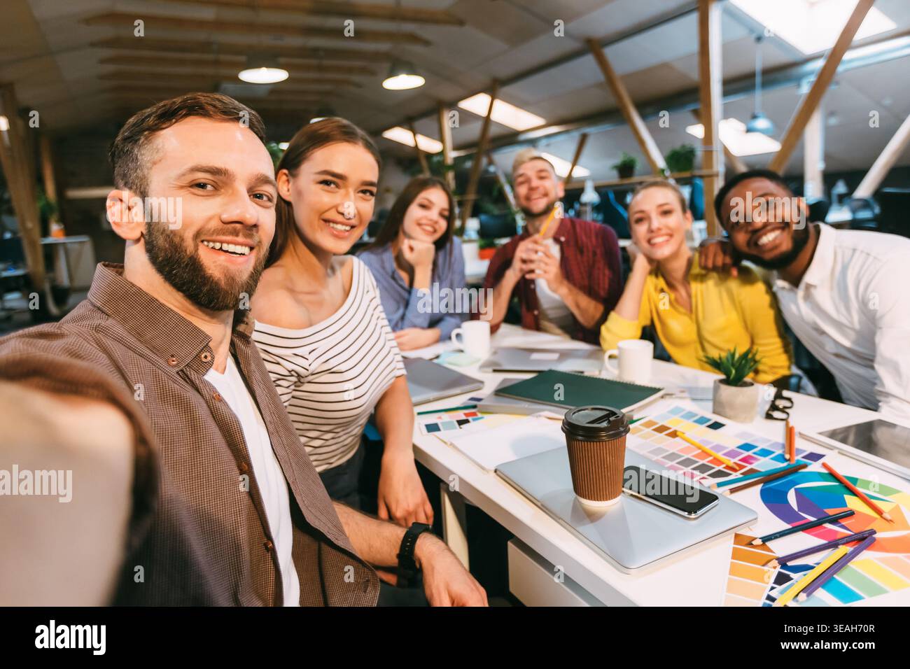 Happy designers making selfie at workplace, working on project Stock Photo