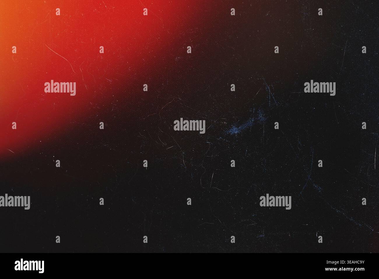 Minimalist dark analog texture with top left red light flare and subtle scratches Stock Photo
