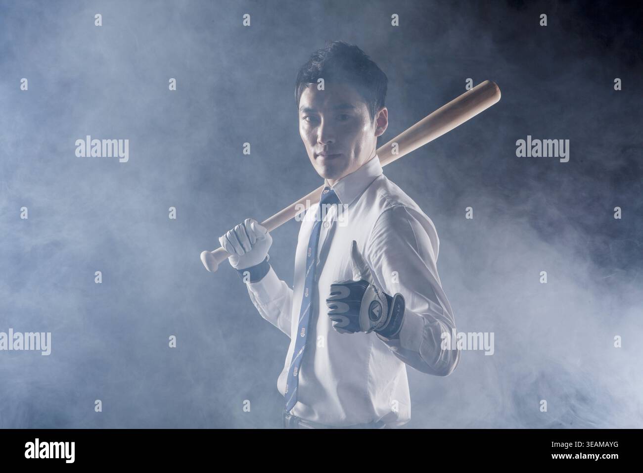 Business man posing with a baseball bat Stock Photo