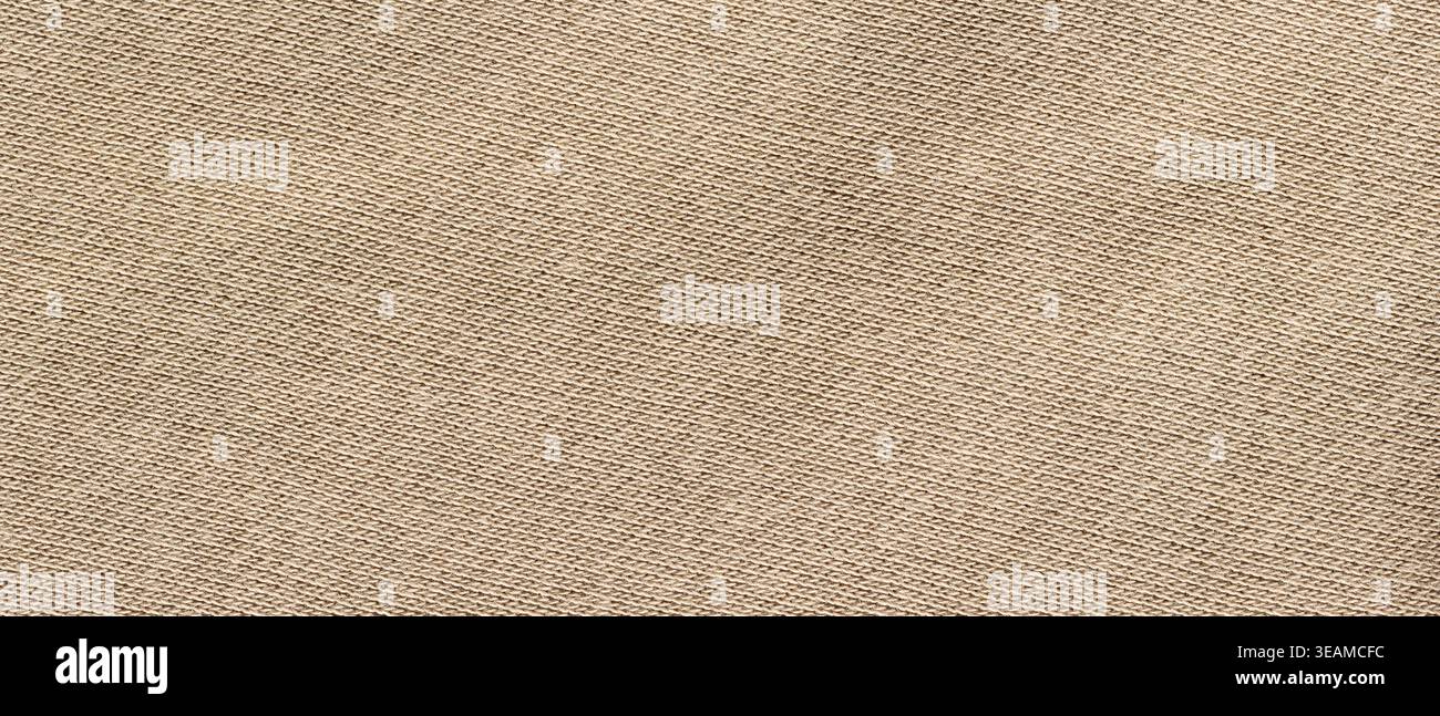 Beige knitted cotton fabric texture with fine diagonal weave pattern as a background Stock Photo