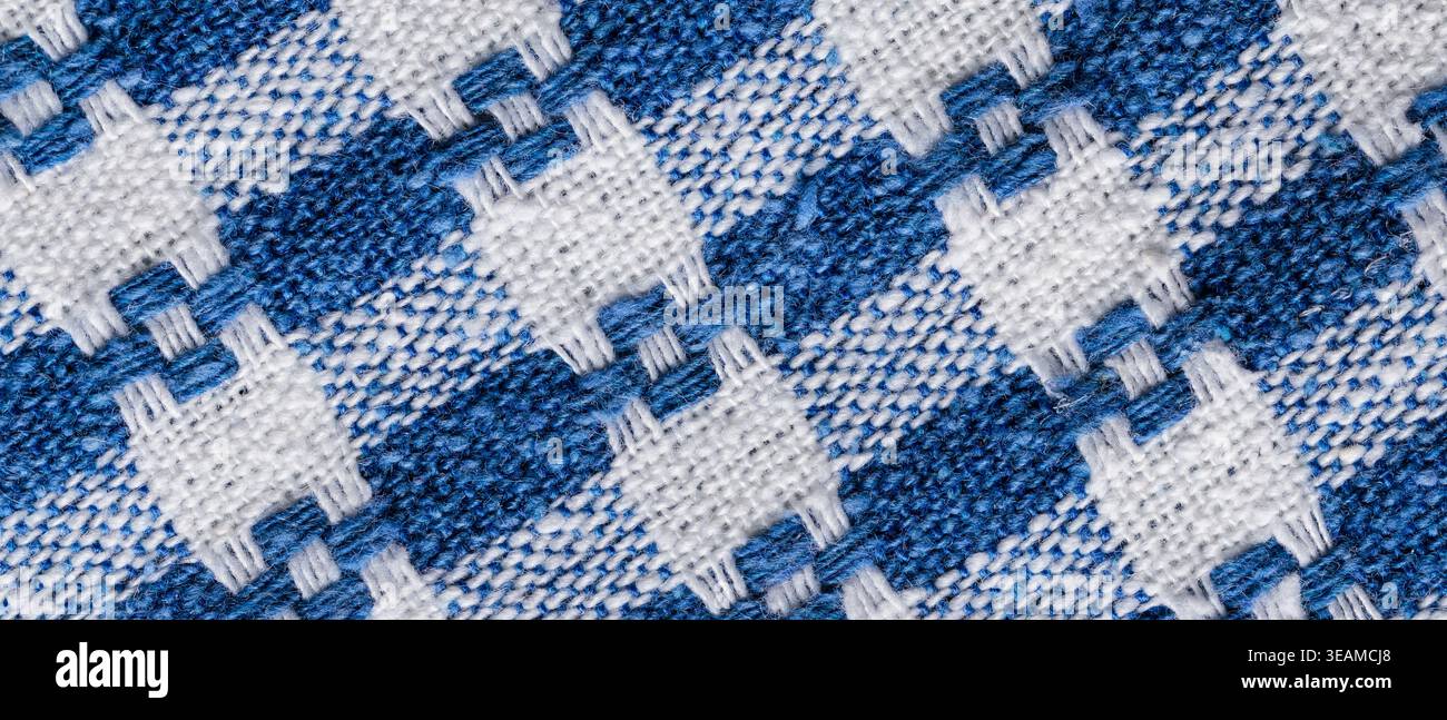 Blue and white woven gingham fabric texture background with checkered pattern for country rustic backdrop Stock Photo