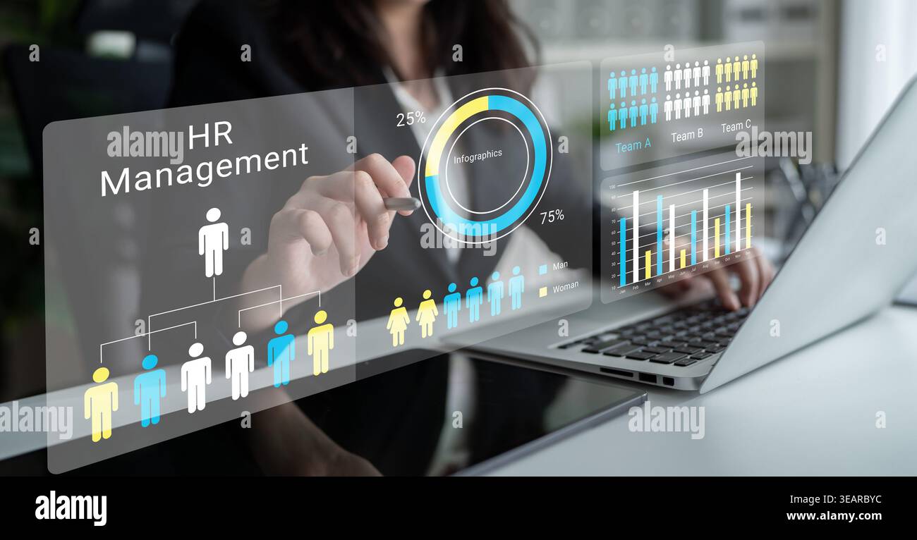A professional interacts with advanced digital tools for HR management, displaying analytics and performance metrics through visual data in a modern Stock Photo