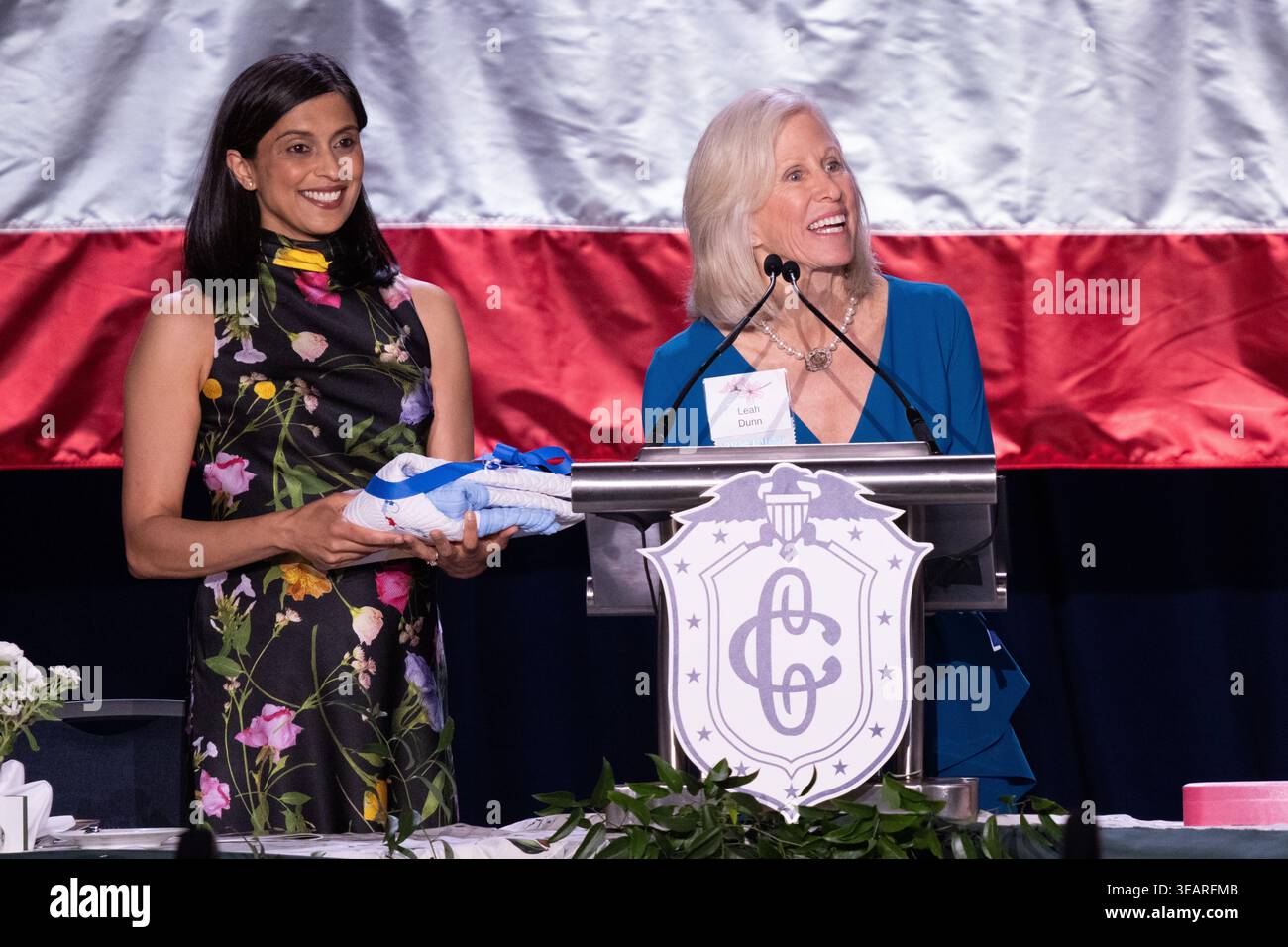 Robin Allen, chair of the First Lady's Luncheon, presents Second Lady Usha  Vance with a set of baby clothes, during the 113th Annual First Lady's  Luncheon in Washington, DC, USA, 23 April