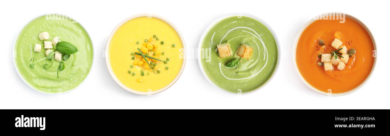 Different tasty soups in bowls isolated on white, set. Top view Stock Photo