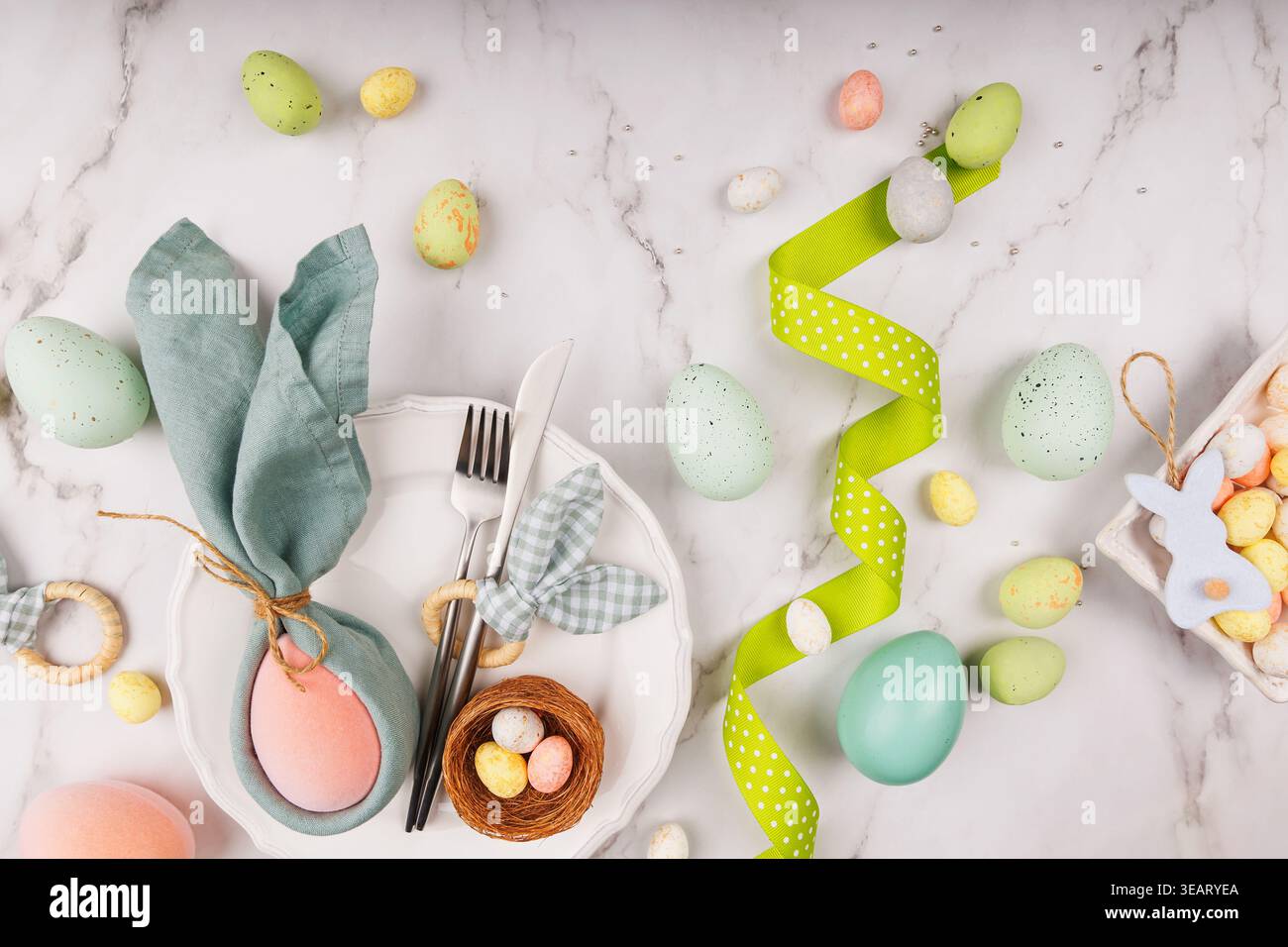 Colorful Easter Eggs and Spring Ribbon on Marble Table Stock Photo