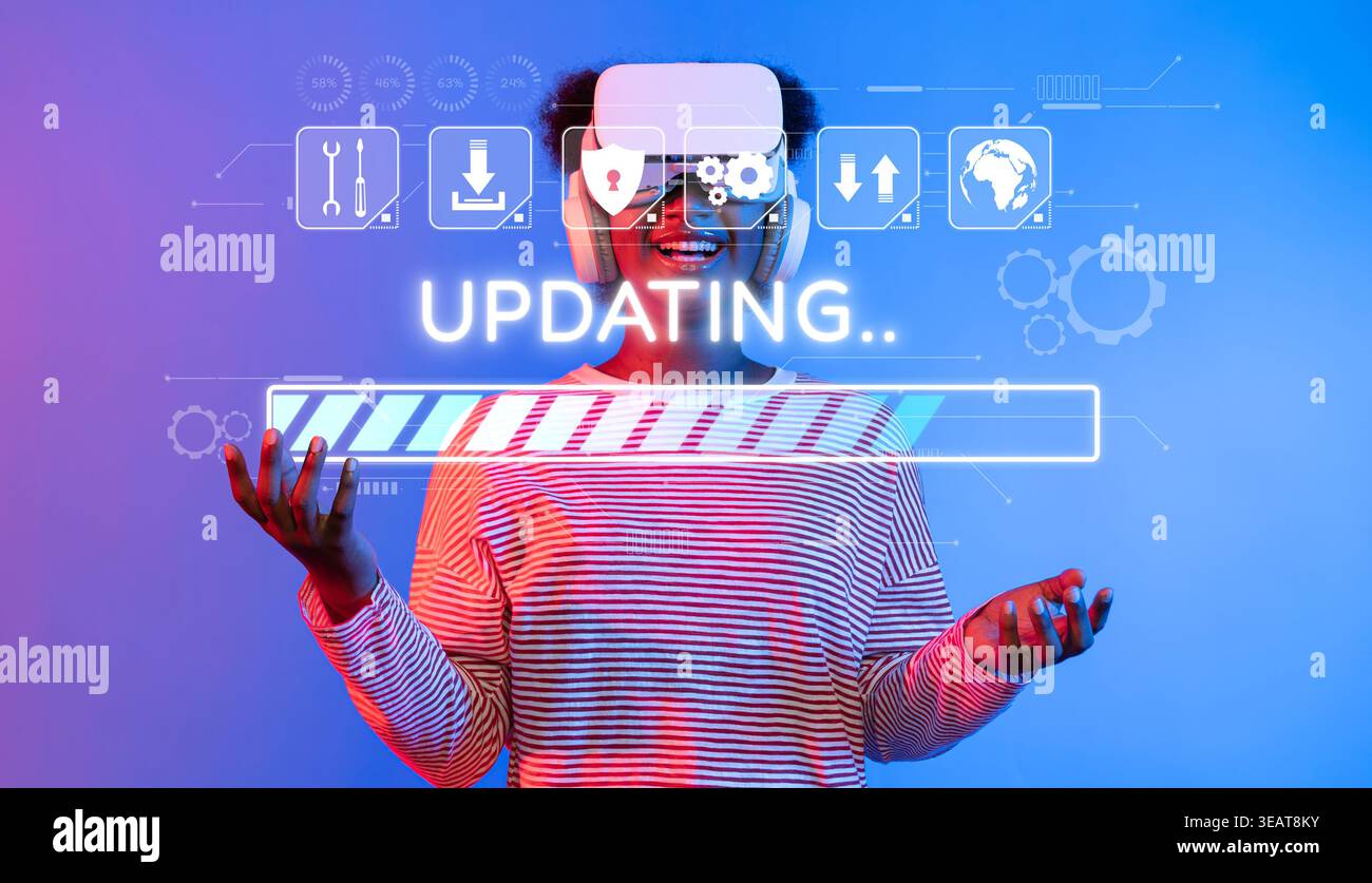 A young individual wearing a virtual reality headset engages in a software update, visualizing a progress bar, representing modern technology and Stock Photo